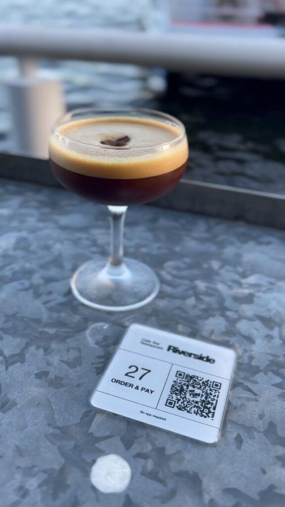 an espresso martini and qr code ordering button on the riverfront